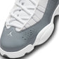 White and cool grey Air Jordan 6 Rings grade school sneakers for kids, featuring Nike Air Jordan branding and stylish design.