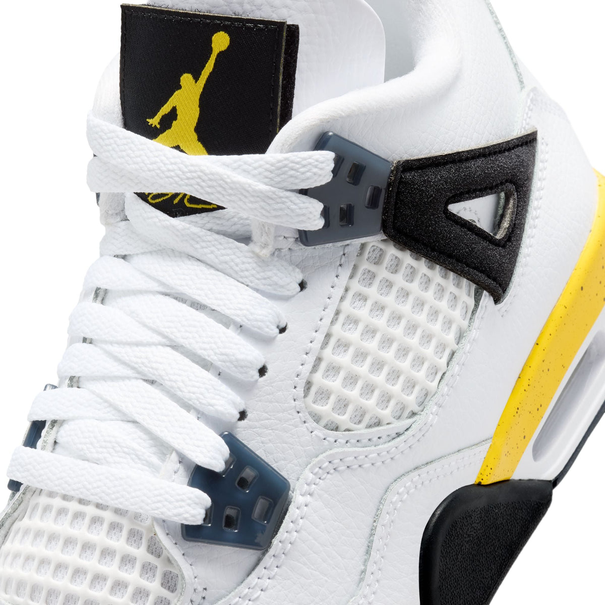 Grade school Air Jordan 4 Retro sneakers for big kids in Tour Yellow, featuring a stylish yellow and black design with Nike branding.