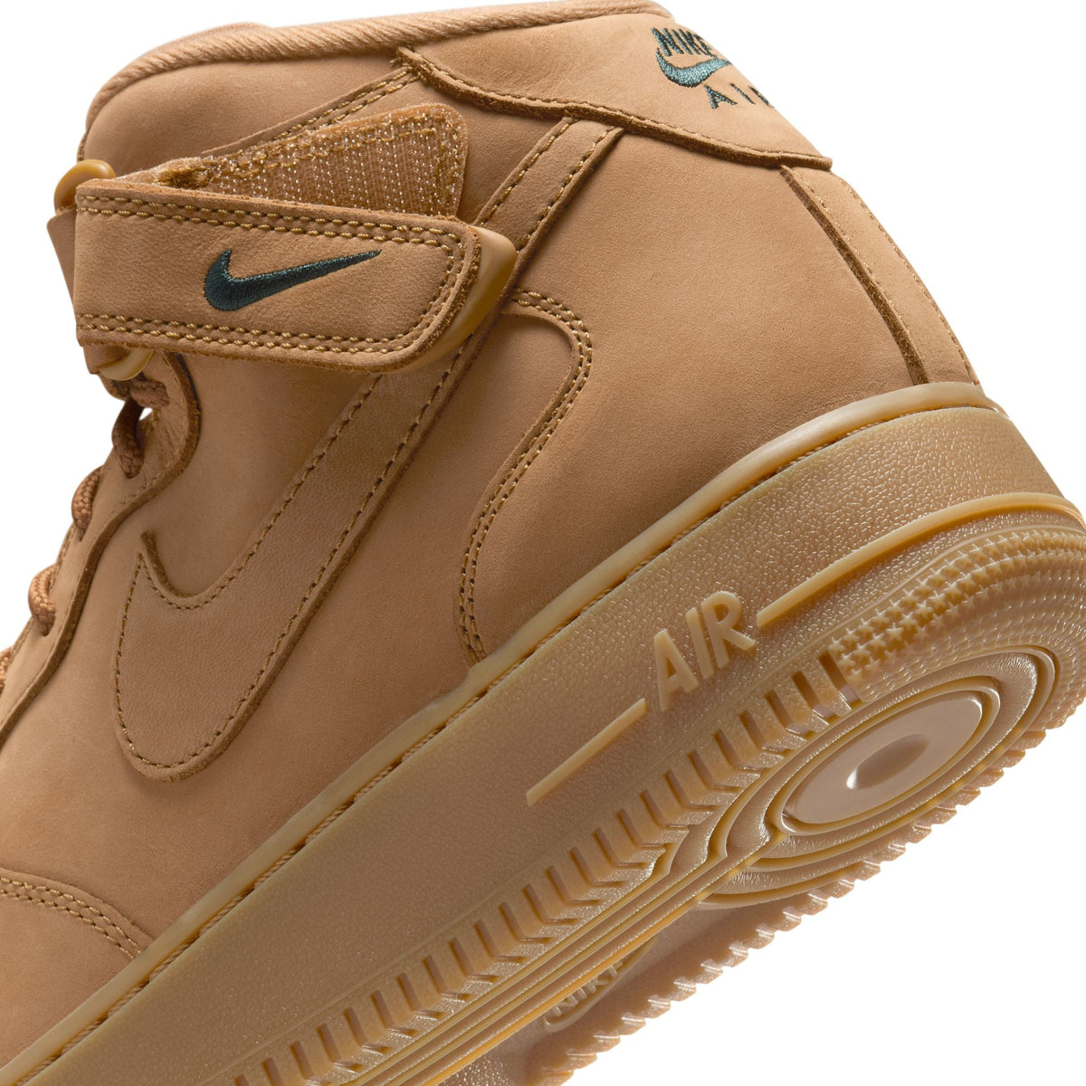Nike men's Air Force 1 Mid Flax sneakers in tan leather with padded ankle collar and classic lace-up design