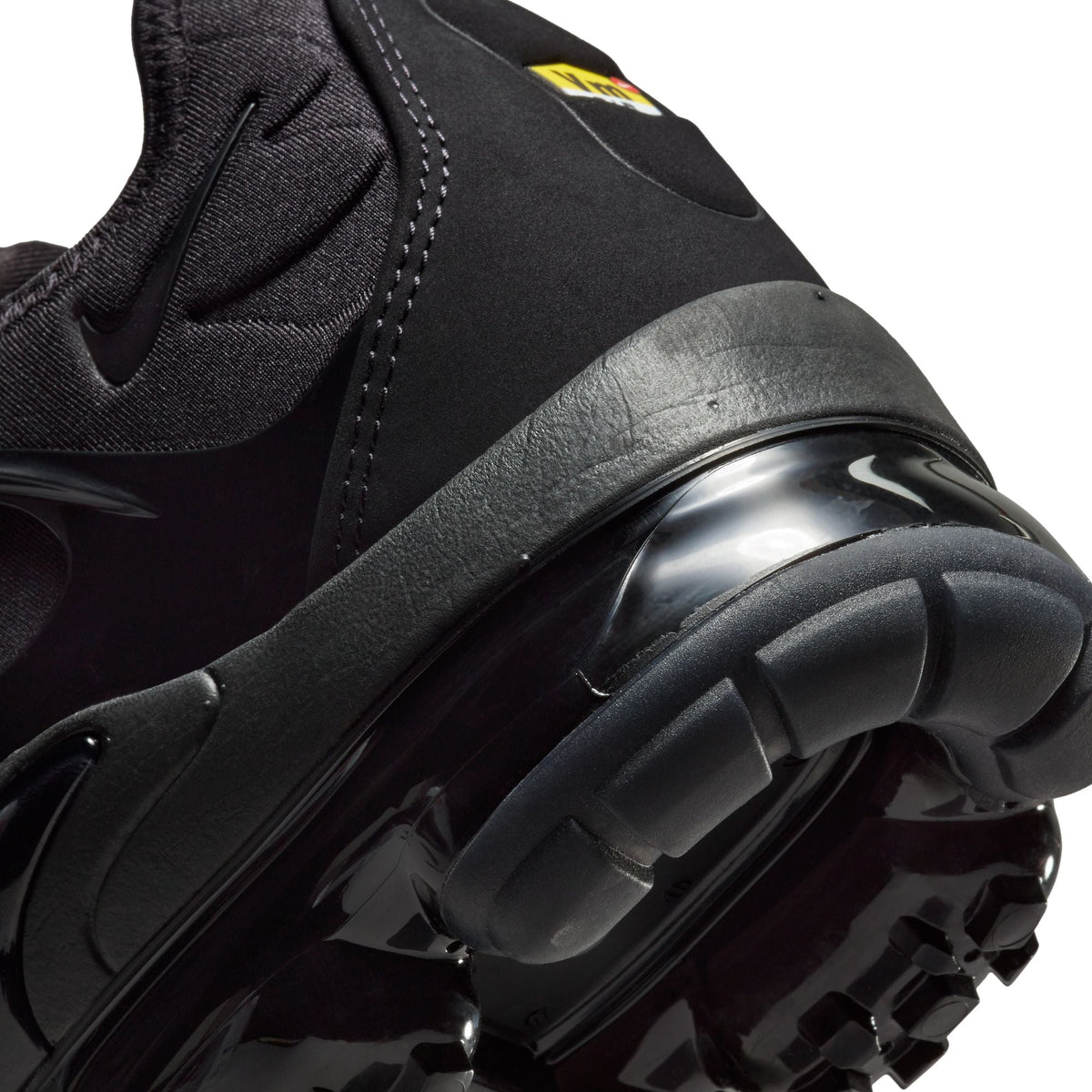 Black and black Nike men's Air VaporMax Plus sneakers, side view