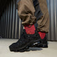 Black Nike Air VaporMax Plus men's sneakers in side view with visible Air cushioning sole