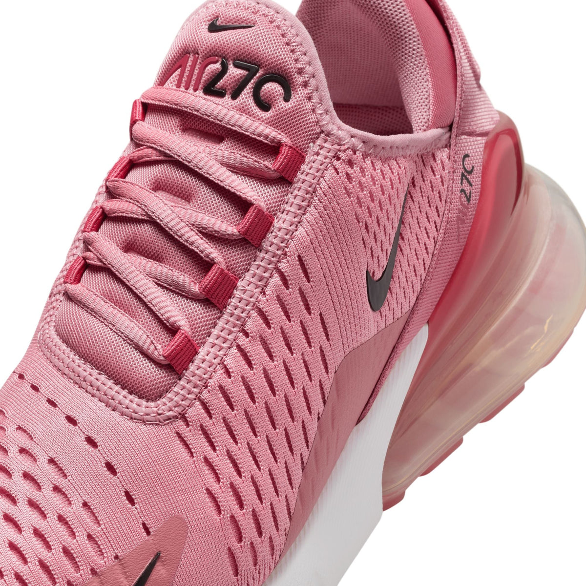 Womens Nike Air Max 270 sneakers in Elemental Pink with white accents, showcasing breathable mesh and cushioned sole.