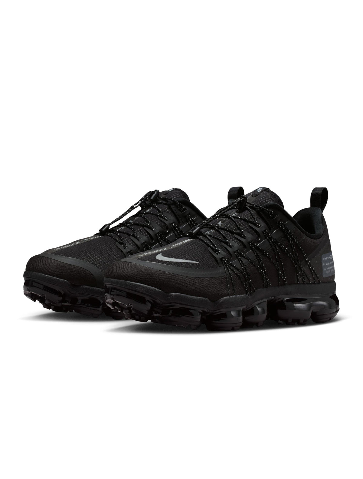 Nike men's Air Vapormax Run Utility shoes in black with silver accents, featuring a sleek athletic design and breathable mesh upper.