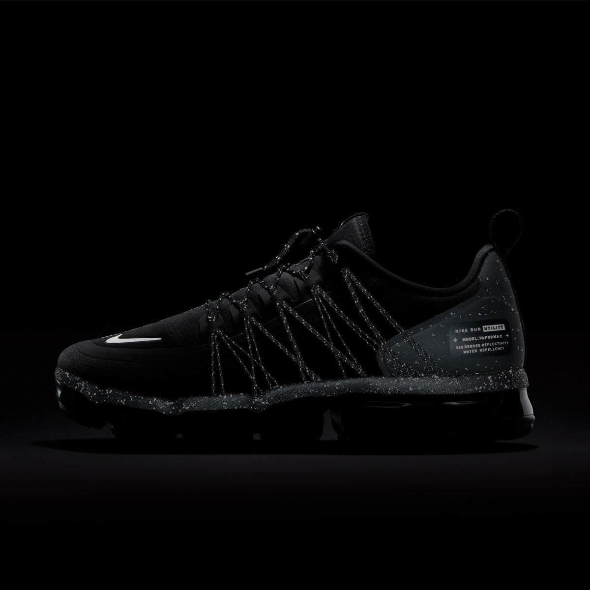 Nike men's Air Vapormax Run Utility sneakers in black and reflect silver, featuring a sleek design and breathable mesh upper.