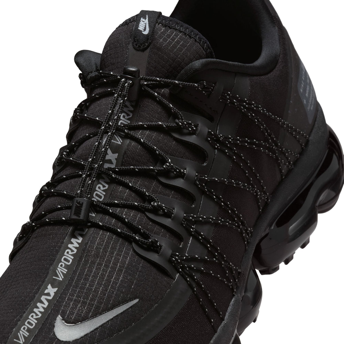 Nike men's Air Vapormax Run Utility sneakers in black and silver, featuring breathable mesh and cushioned sole for comfort.