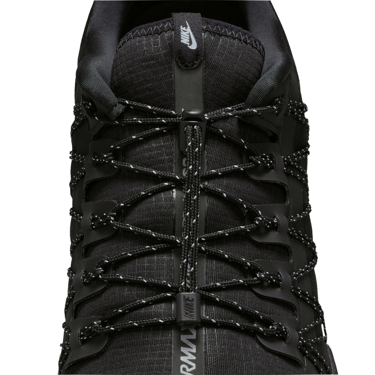 Nike men's Air Vapormax Run Utility sneakers in black with reflective silver accents, showcasing a sleek and modern athletic design.