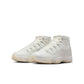 Womens Air Jordan 11 Retro Pearl sneakers in white and silver with patent leather accents, stylishly displayed on a plain background.