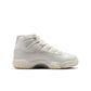 Women's Air Jordan 11 Retro Pearl sneakers in white and pearl, featuring a sleek design and glossy patent leather finish.