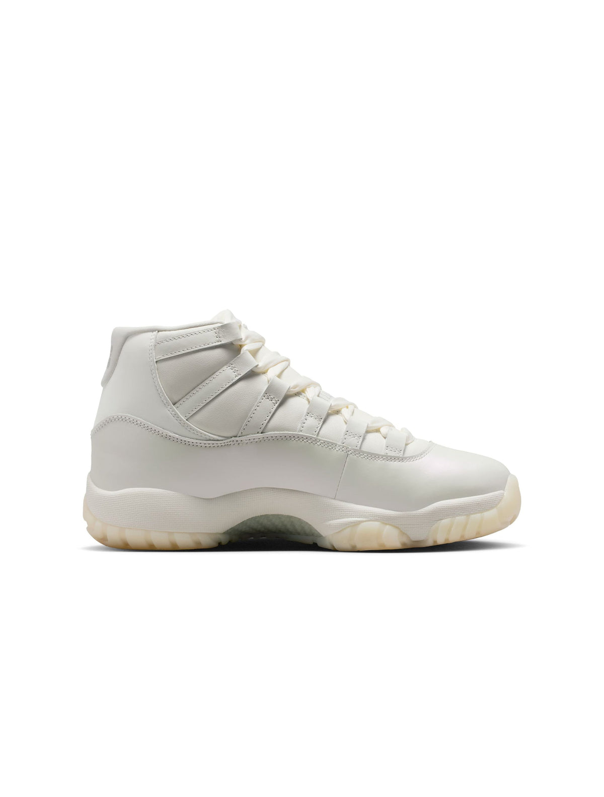 Women's Air Jordan 11 Retro Pearl sneakers in white and pearl, featuring a sleek design and glossy patent leather finish.