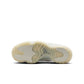 Women's Air Jordan 11 Retro Pearl sneakers in light-colored leather and patent finish, showcasing stylish footwear design.