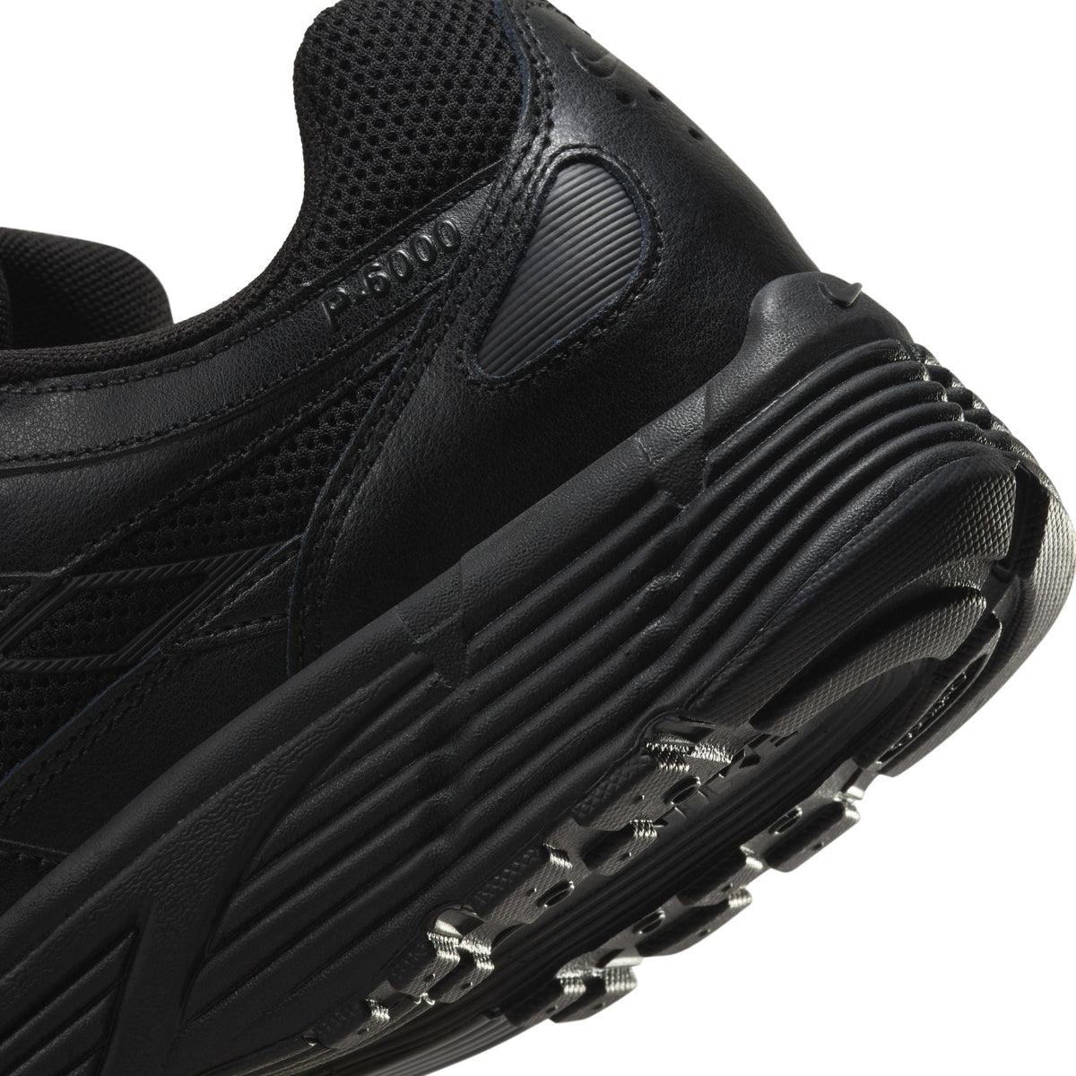 Nike men's P-6000 black sneakers by Denim Exchange, side view with layered mesh and synthetic panels