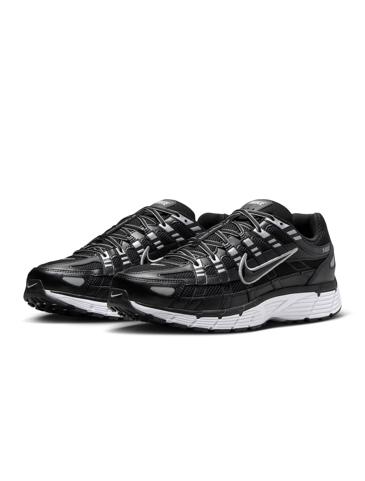 Nike men’s P-6000 black sneakers by Denim Exchange, side view of layered mesh and leather panels