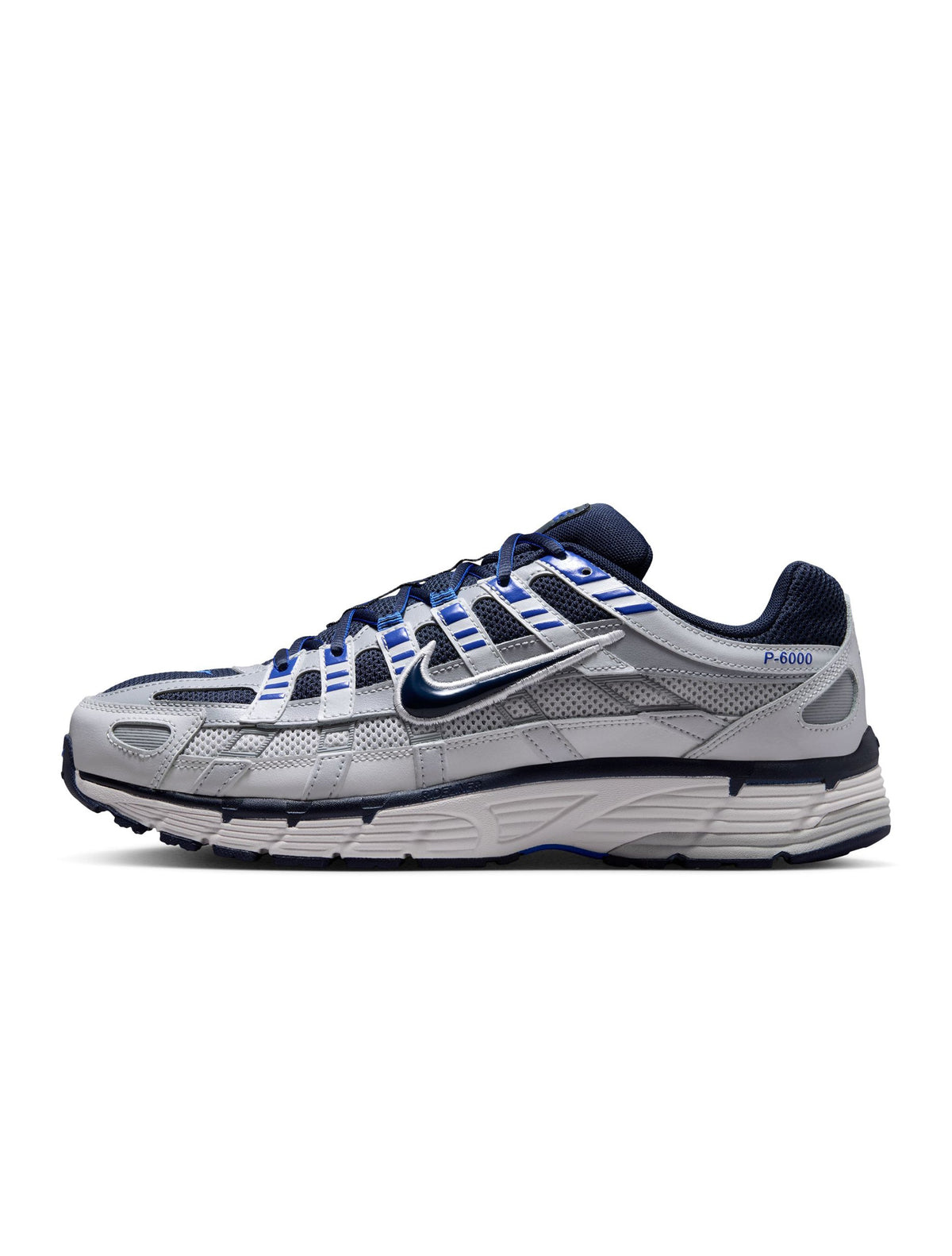 Nike men's P-6000 sneakers in wolf grey, showcasing a sleek athletic footwear design with breathable material and modern style.