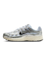 Nike men’s P-6000 footwear in white with metallic silver detailing, side profile sneaker image