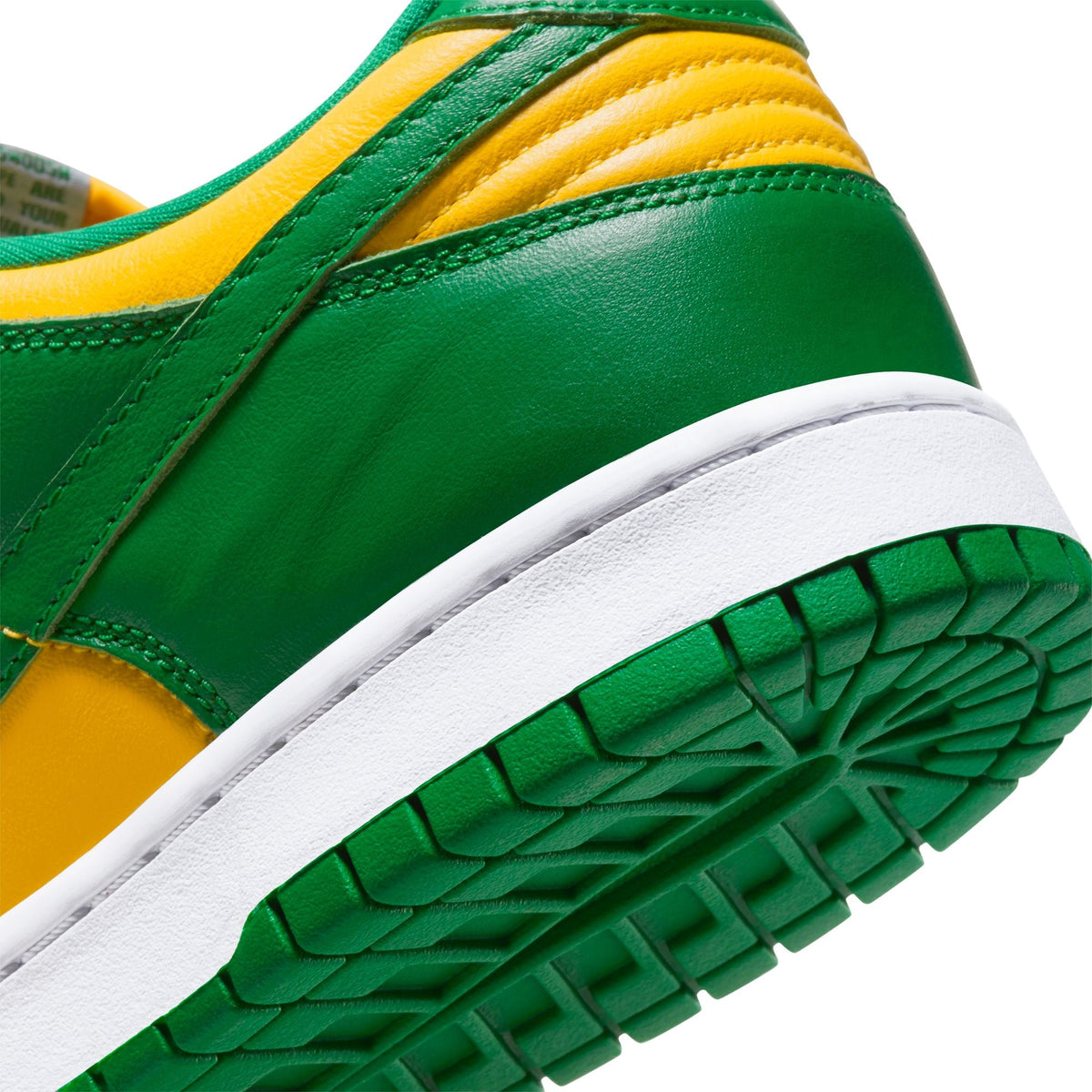 Nike Mens Dunk Low SP Pine Green sneakers in green and white with Nike branding, showcasing the stylish low-top design.