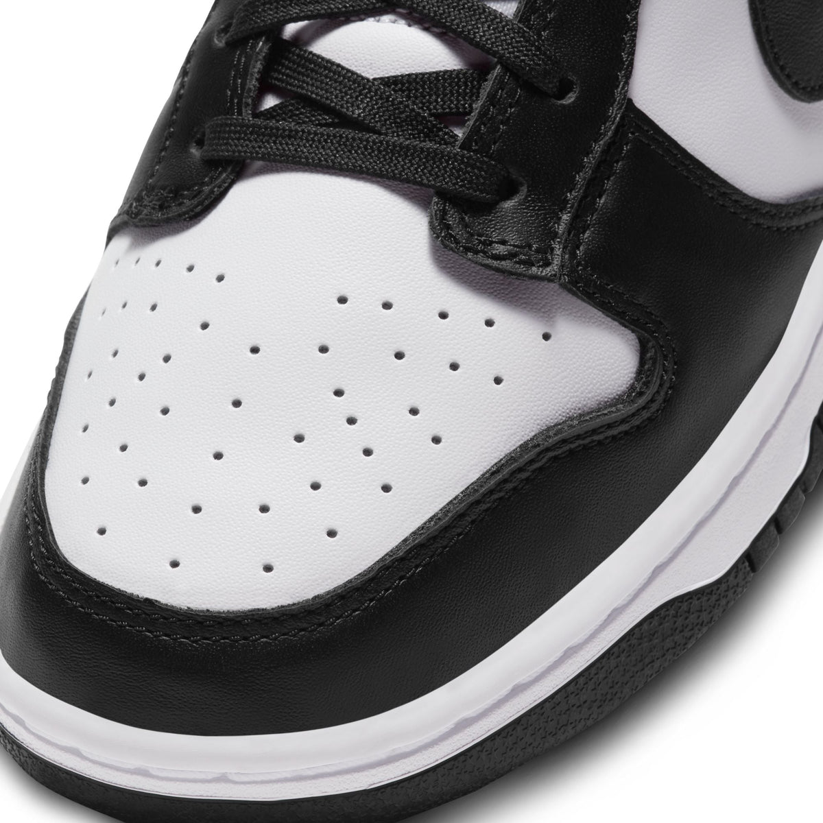 Nike men's Dunk Low Panda sneakers in black and white leather with low-top design
