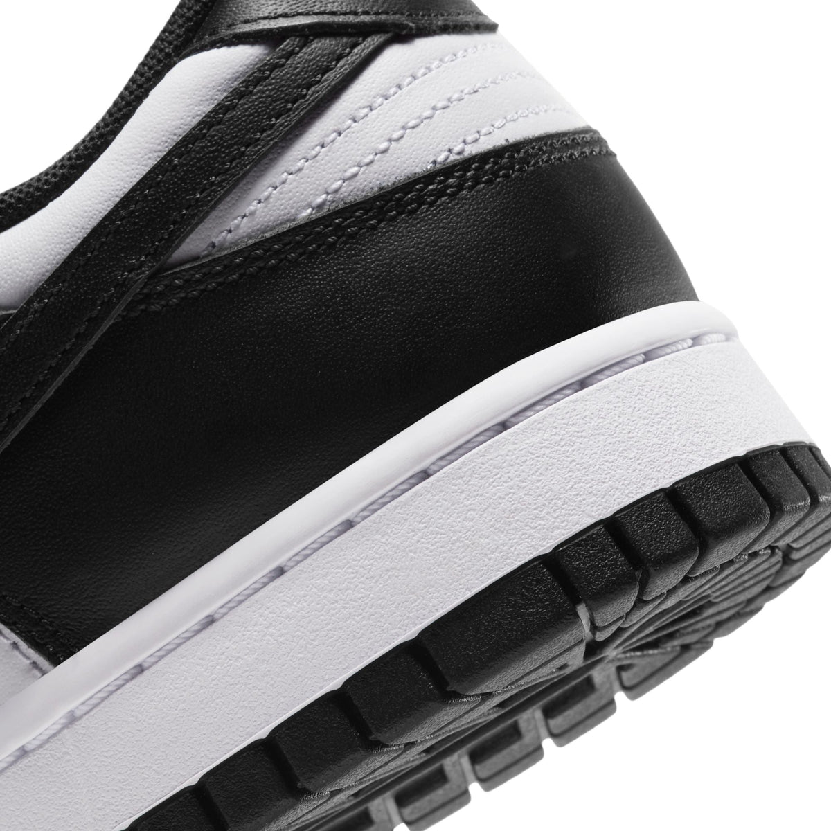 Nike men's Dunk Low Panda sneakers in black and white leather with low-top design