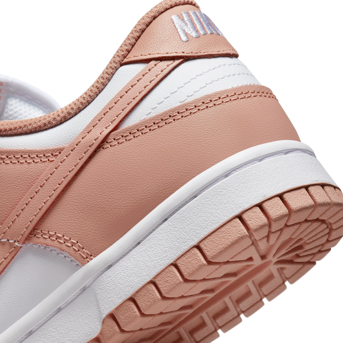Nike Women's Dunk Low Rose Whisper sneakers in a low-top design, side view