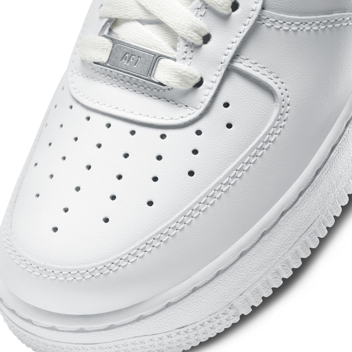 White Nike Women's Air Force 1 '07 sneakers with clean design and Nike branding, showcasing the classic footwear style.