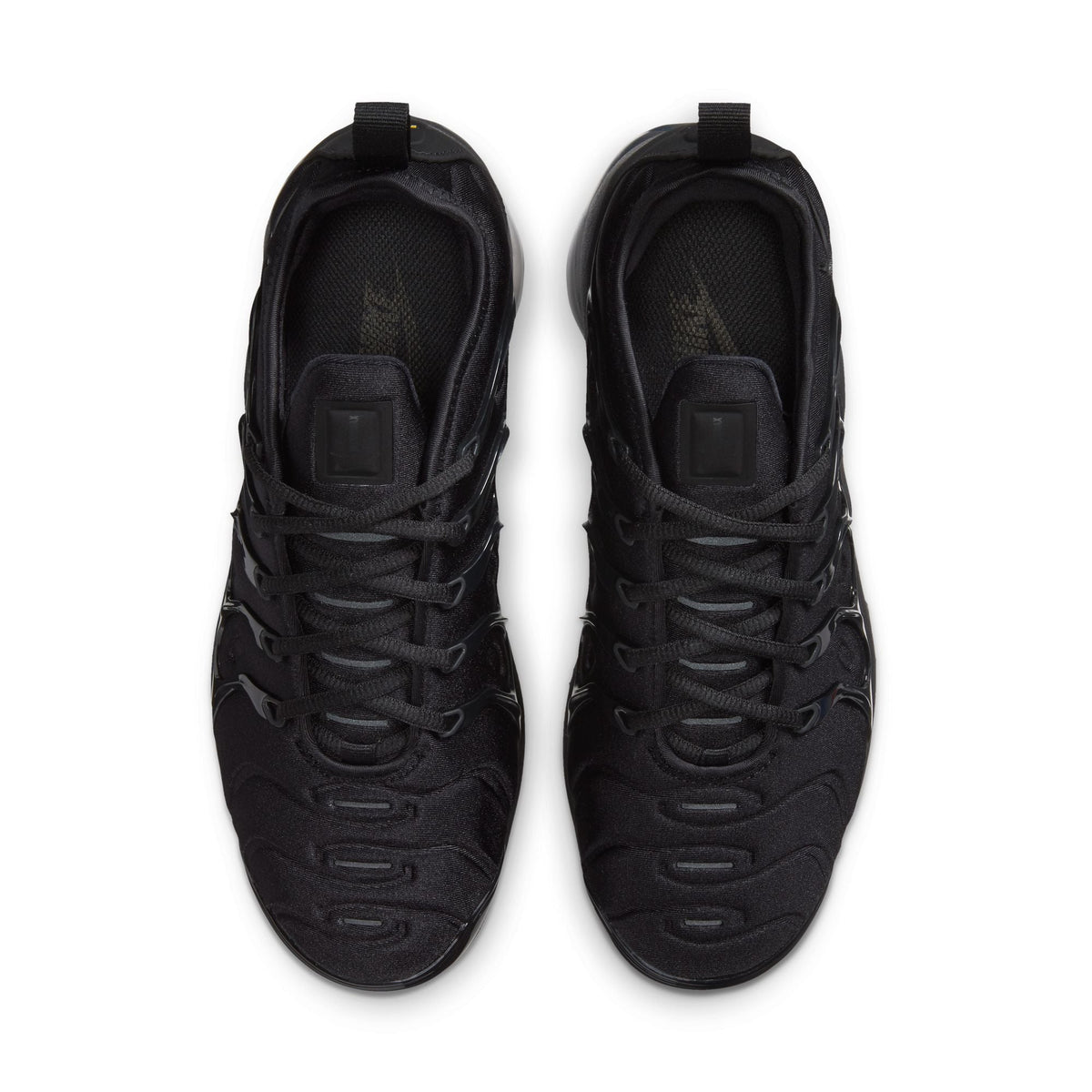 Black and anthracite Nike Women's Air Vapormax Plus sneakers featuring sleek design and breathable mesh uppers.