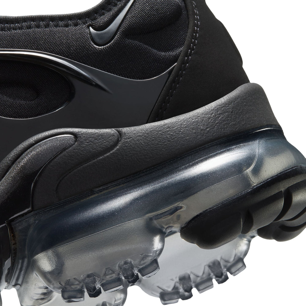 Nike Women's Air Vapormax Plus sneakers in black and anthracite with breathable mesh and rubber sole, designed for sporty style and comfort.