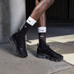 Nike Womens Air Vapormax Plus black and anthracite athletic sneakers with visible Vapormax sole in a close-up shot.
