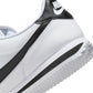 Nike men's Cortez white and black sneakers, side view with classic low-top design