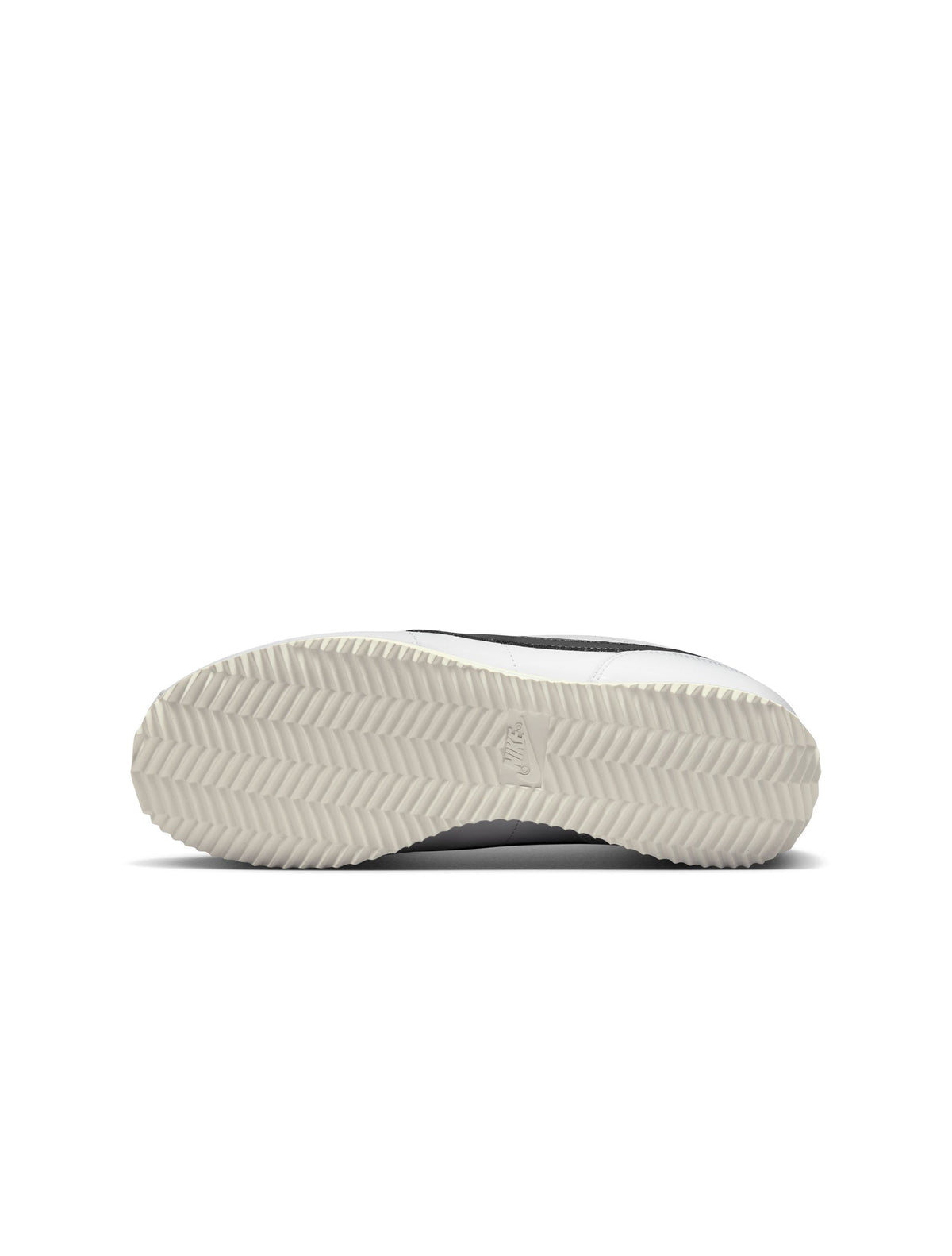 White and black Nike Women's Cortez leather sneakers featuring classic design and white laces, perfect for casual wear.
