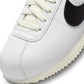 White and black Nike Women's Cortez leather sneakers, stylish footwear with classic design and comfortable fit.