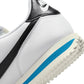White and black Nike Women's Cortez leather sneakers, stylish athletic footwear with classic design and comfortable fit.
