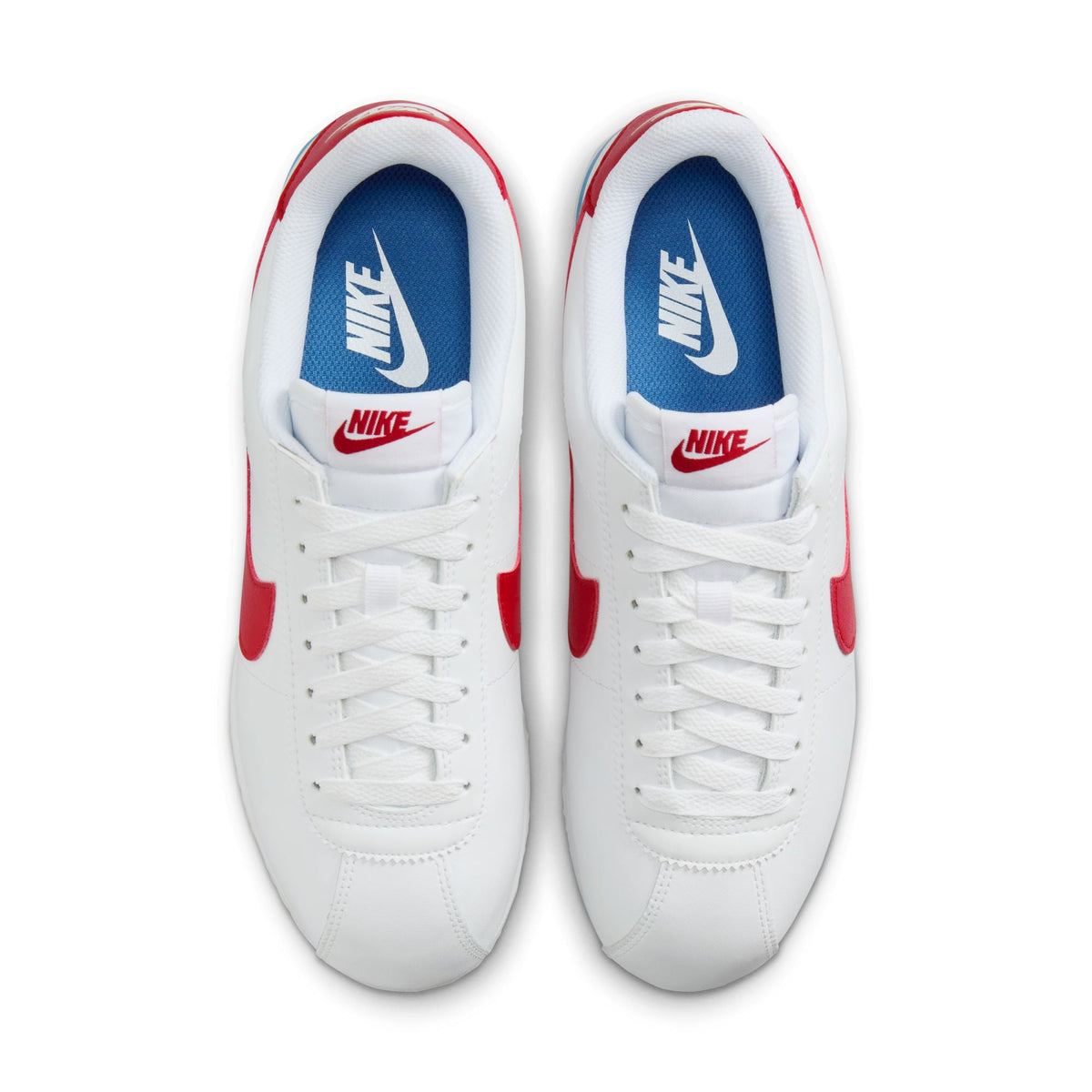 Nike Womens Cortez Leather Forrest Gump sneakers, denim blue and white footwear with classic design and Nike branding.