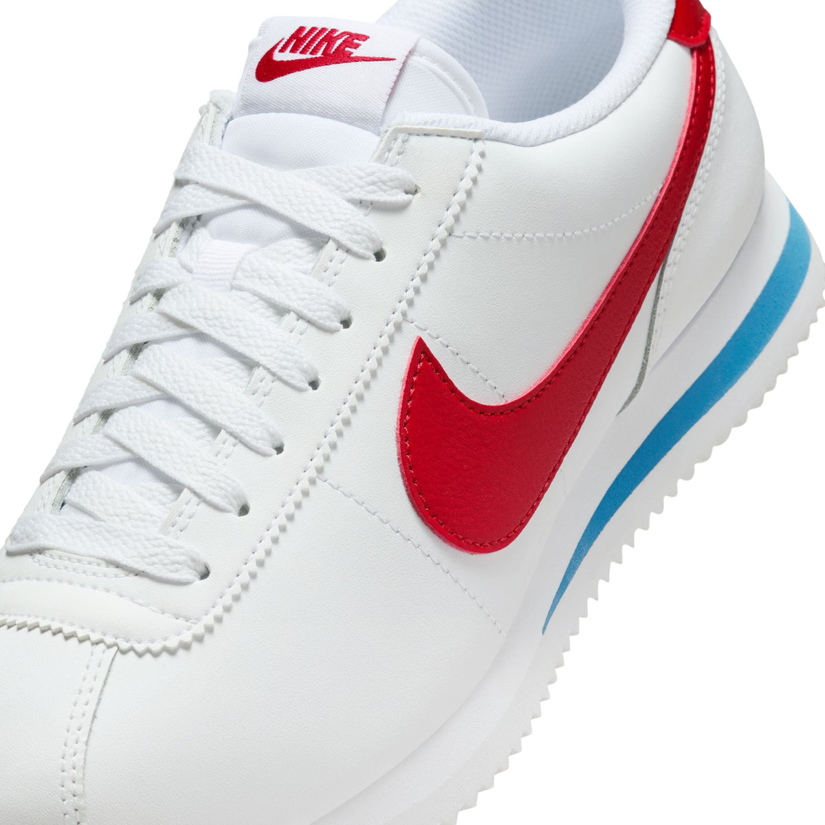 Nike Womens Cortez Leather Forrest Gump sneakers, blue and white leather footwear with Nike branding and classic design.