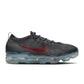 Nike men's Air Vapormax 2023 Flyknit sneakers in dark grey with Gym Red accents