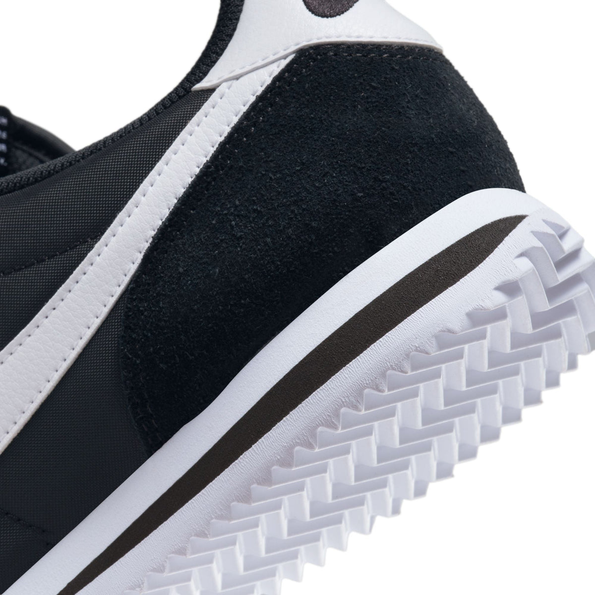 Nike Womens Cortez black and white sneakers, classic athletic footwear for women, featuring a sleek design and comfortable fit.