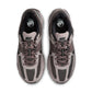 Men's Nike Zoom Vomero 5 running shoes in College Grey with white accents, featuring breathable mesh and cushioned sole.