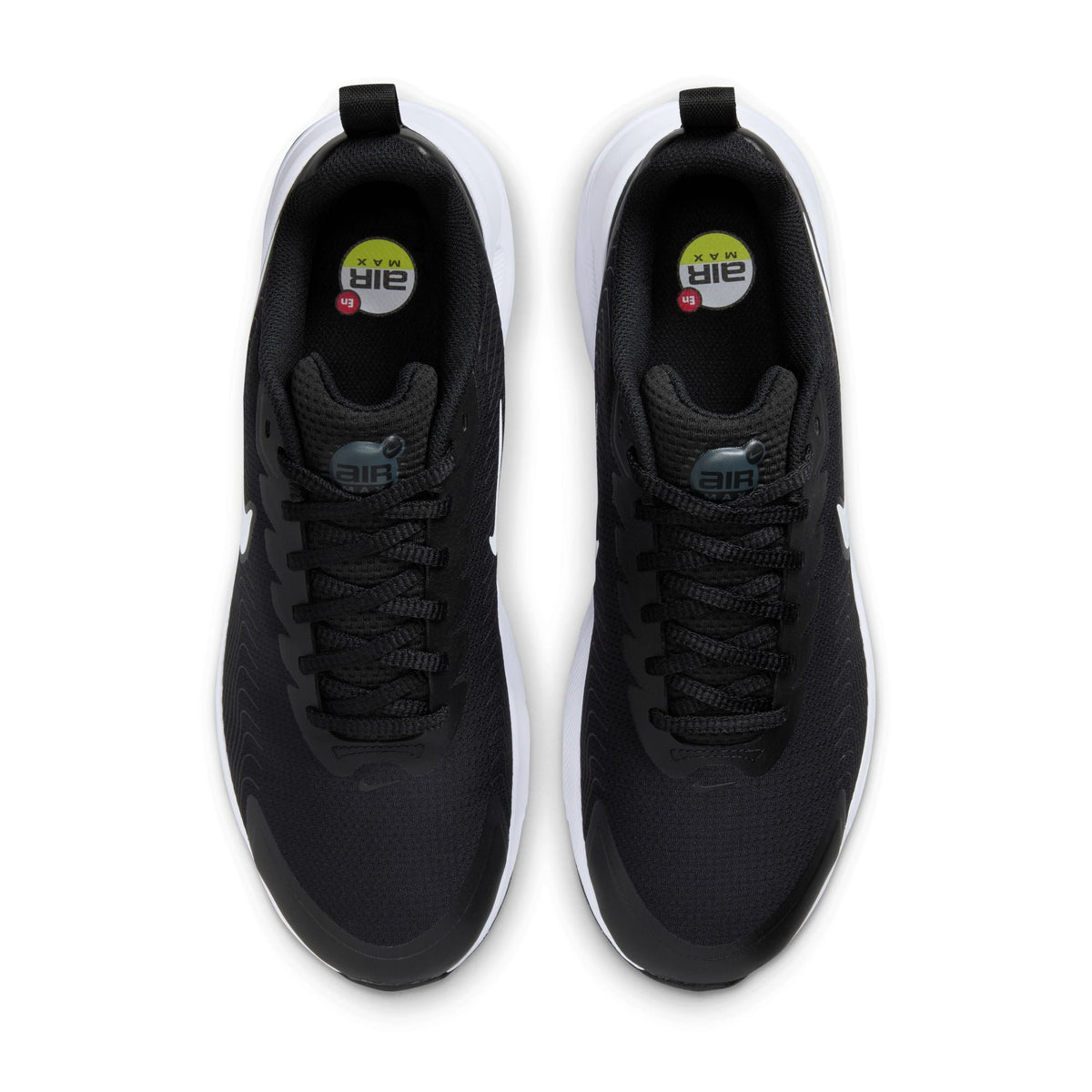 Nike men's Air Max Nuaxis sneakers in black and white, showcasing the sleek design and breathable mesh upper.