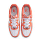 Nike Men's Air Force 1 '07 sneakers in Orange Frost color, shown from the side with white midsoles and orange accents.