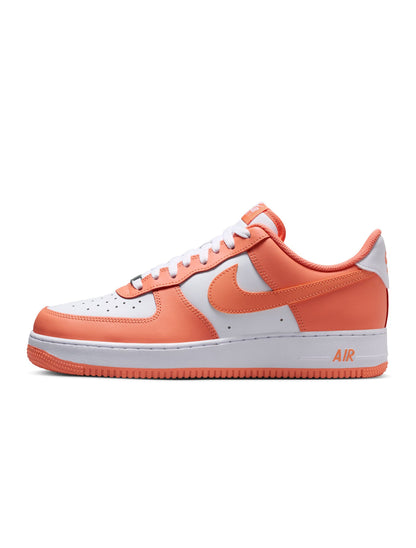 Nike Men's Air Force 1 '07 sneakers in Orange Frost, featuring a sleek design and classic Nike style.