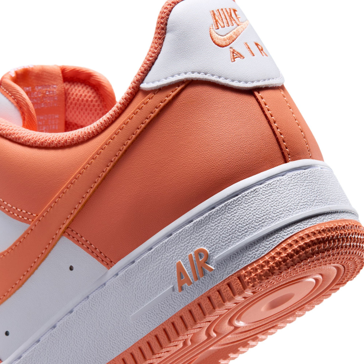 Nike Mens Air Force 1 '07 Orange Frost sneakers, casual footwear with orange and white colorway, featuring Nike branding and classic design.