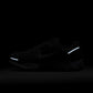 Men's Nike Zoom Vomero 5 sneakers in wolf grey and white, side view; Denim Exchange footwear listing