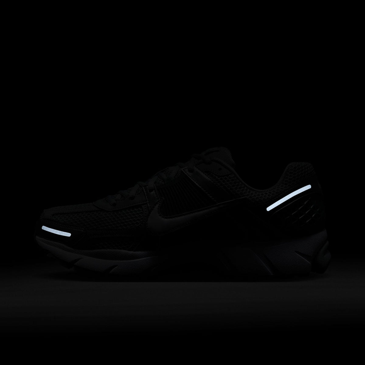 Men's Nike Zoom Vomero 5 sneakers in wolf grey and white, side view; Denim Exchange footwear listing