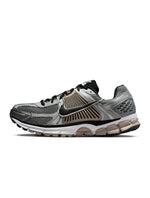 Nike men's Zoom Vomero 5 sneakers in metallic silver, side view, by Denim Exchange