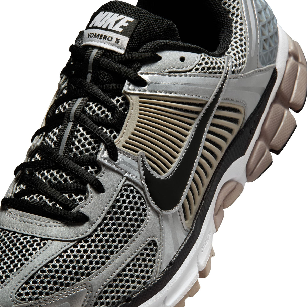 Nike men's Zoom Vomero 5 sneakers in metallic silver, side view