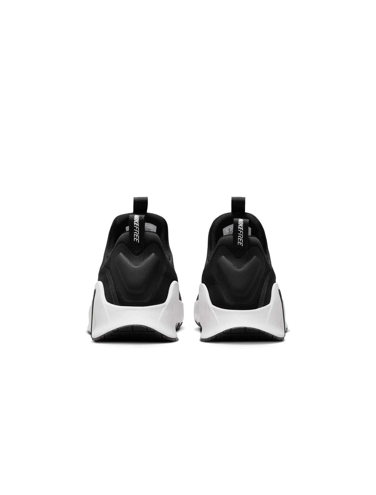 Nike Womens Free Metcon 6 black and white athletic shoes with supportive design for women, displayed on a plain background.