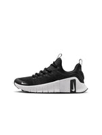 Nike Womens Free Metcon 6 running shoes in black and white, featuring lightweight design and flexible sole, shown from side view.