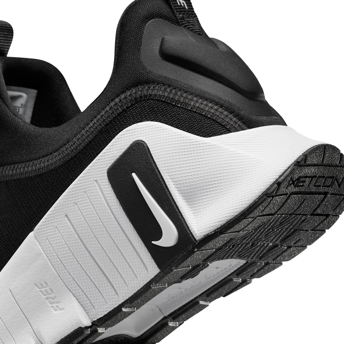 Nike Women's Free Metcon 6 athletic shoes in black and white, designed for versatile training and performance.