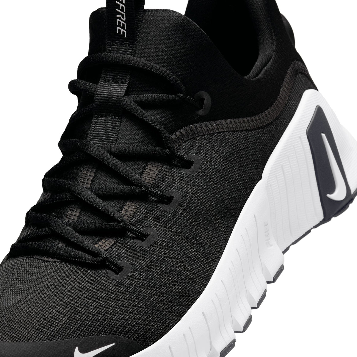 Nike Men's Free Metcon 6 black and white training shoes, side view, by Denim Exchange