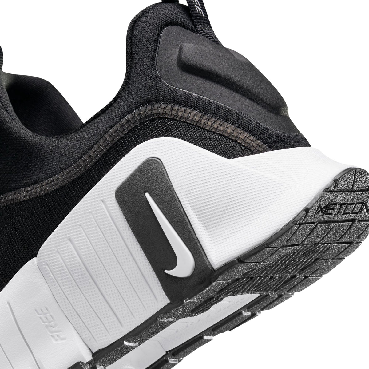 Nike Men's Free Metcon 6 black and white training shoes, side view.