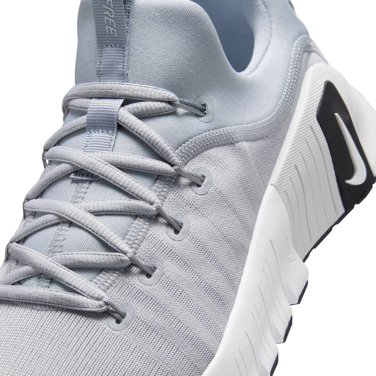 Men's Nike Free Metcon 6 footwear in wolf grey, side view with textured mesh upper and flexible sole