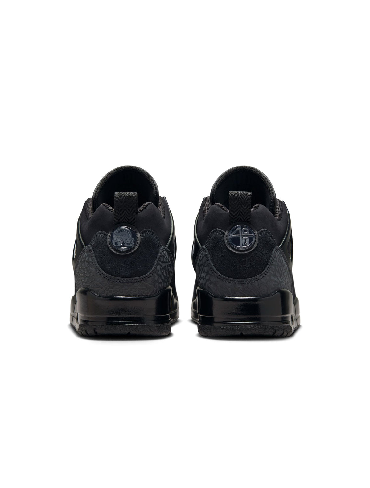 Air Jordan Men's Spizike Low sneakers in black, featuring a low-top design and mixed-panel detailing